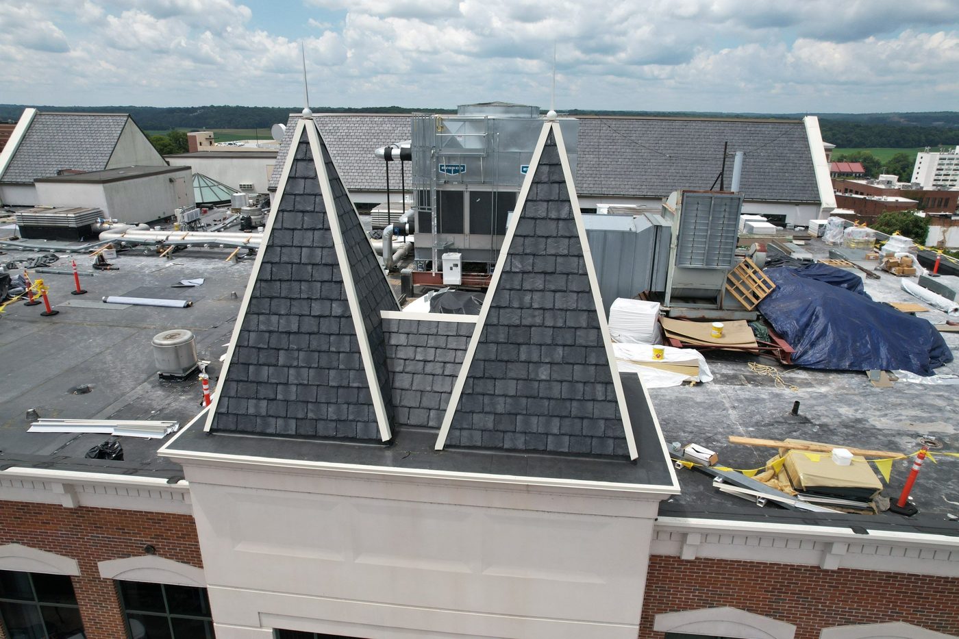 Synthetic slate roof turrets on a commercial building